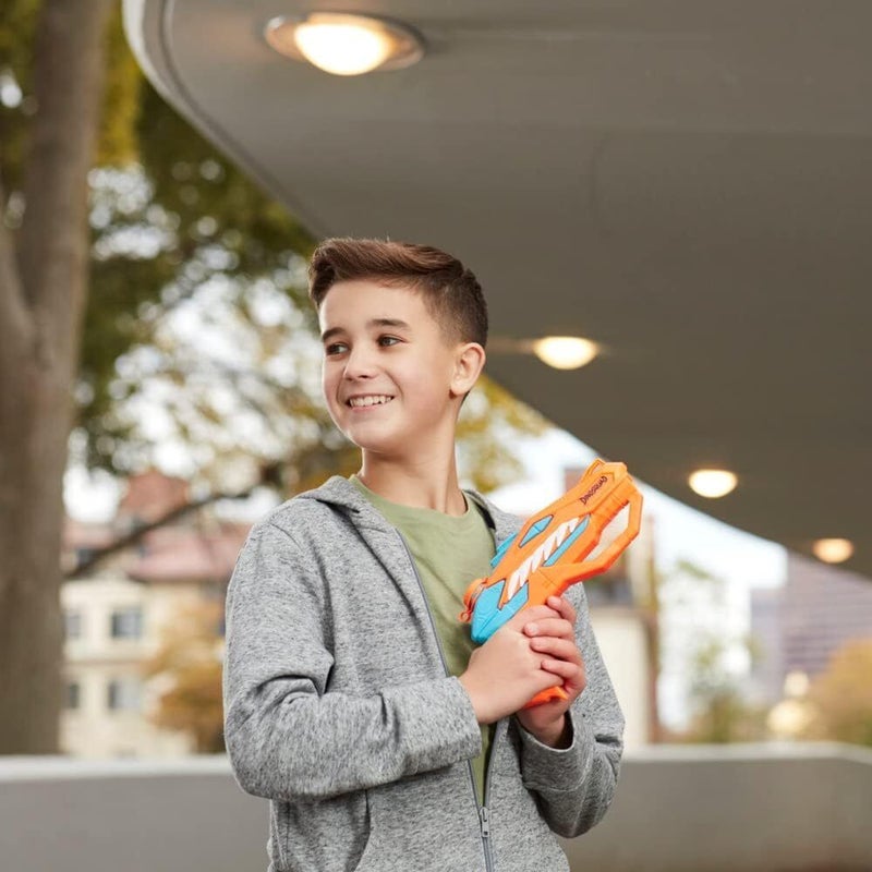 Kid posing with Nerf Dinosquad Raptor Surge