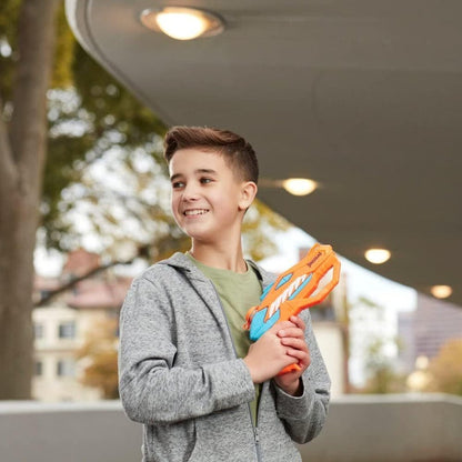 Kid posing with Nerf Dinosquad Raptor Surge