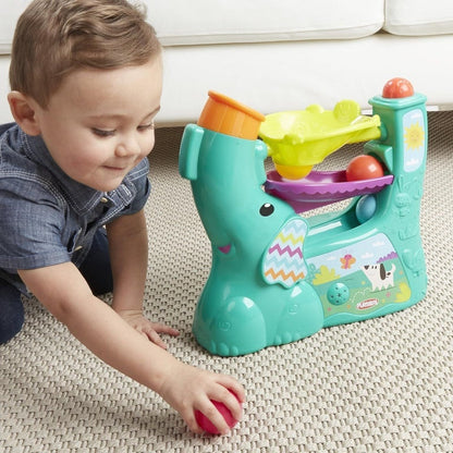 child playing with playskool ball popper toy