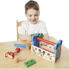Child playing with Melissa & Doug Mickey Mouse Wooden Tool Box Toy