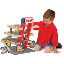 Child Playing With Melissa and Doug Wooden Parking Garage Toy